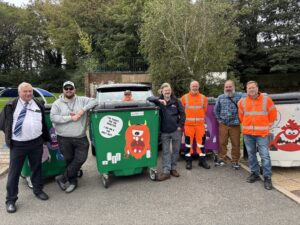 whg staff and Walsall Council with new monster bins